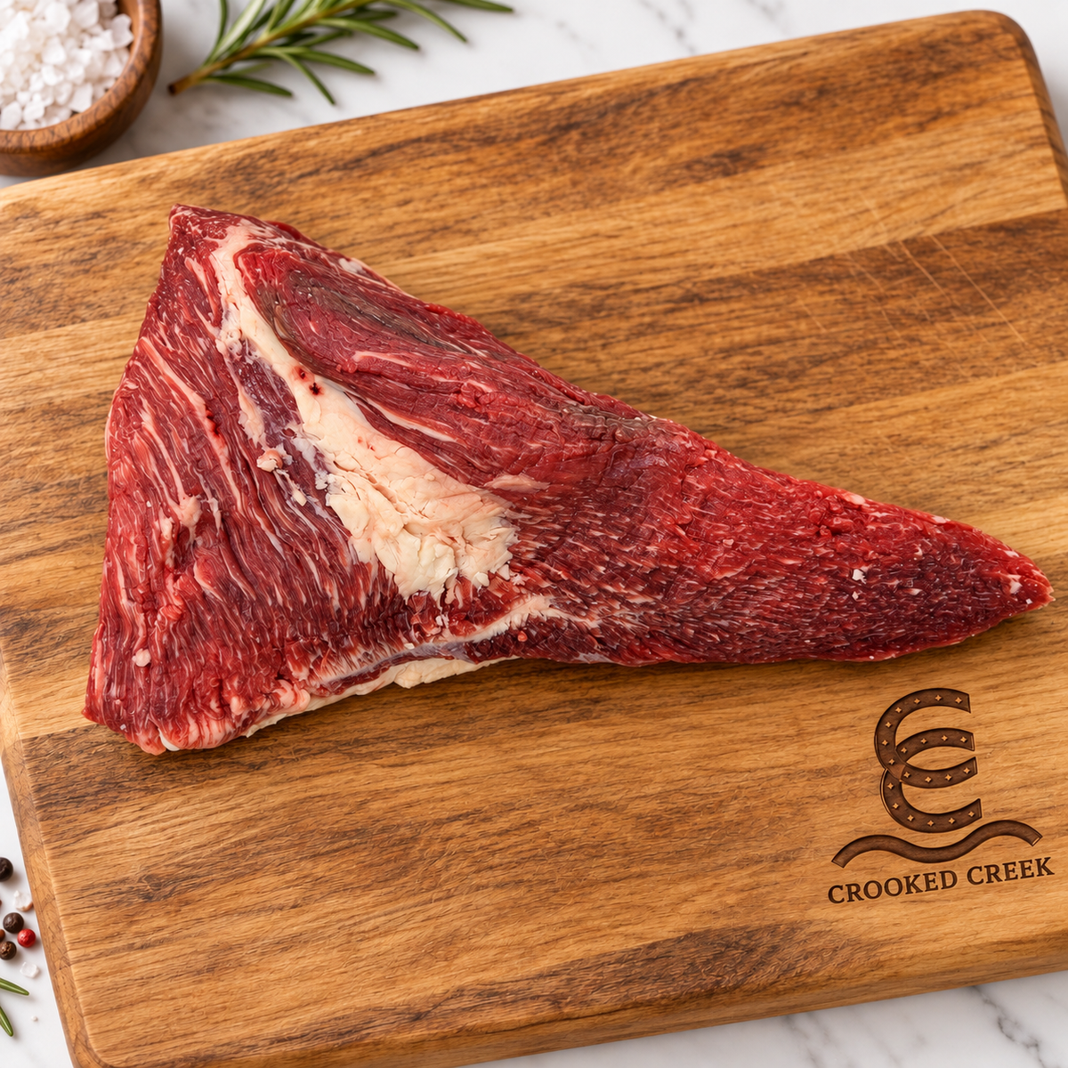 The Maverick Akaushi tri-tip roast on a Crooked Creek wooden cutting board