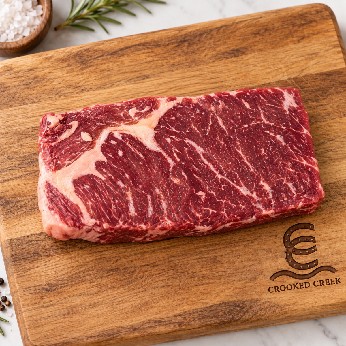 The Prospector Akaushi Denver steak on a Crooked Creek wooden cutting board
