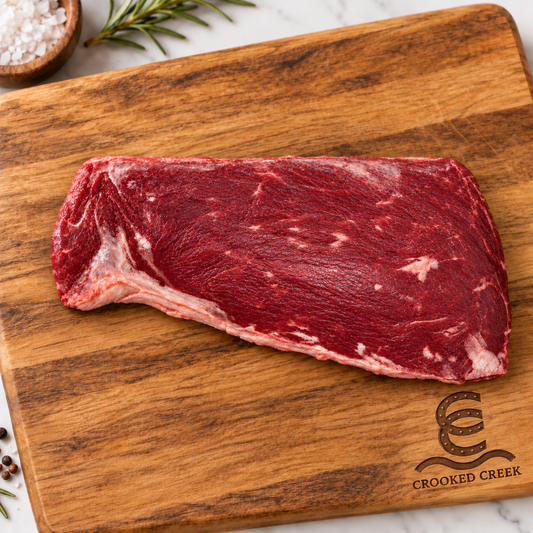 Crooked Creek Akaushi mock tender roast on a branded wooden cutting board