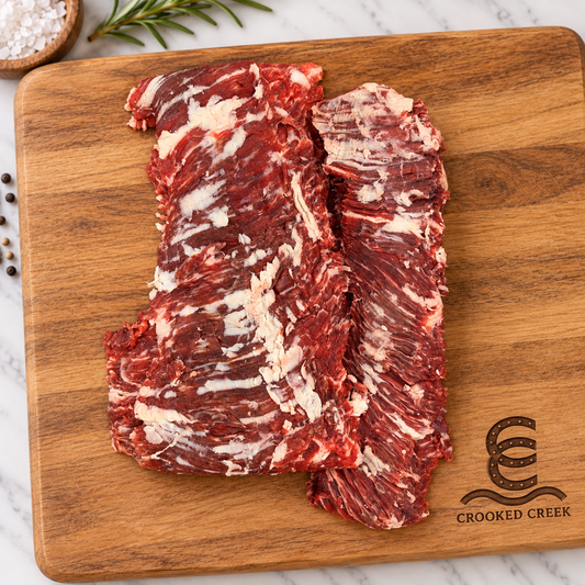The Outrider Akaushi skirt steak, original cuts on a Crooked Creek cutting board