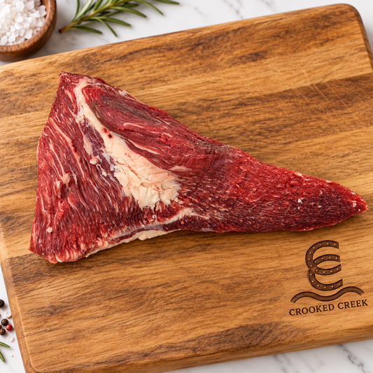 The Maverick Akaushi tri-tip roast on a Crooked Creek wooden cutting board