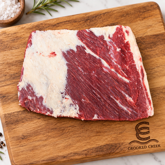 Akaushi brisket flat cut on a Crooked Creek wooden cutting board